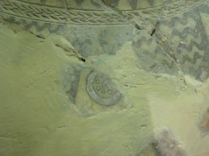 A solar disc with a solar symbol in the middle